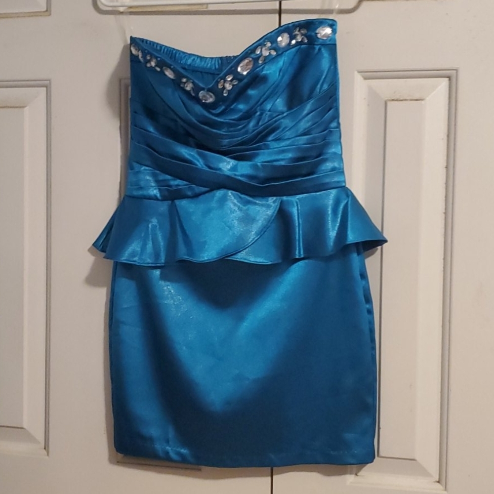Teal dress. Never wore it.